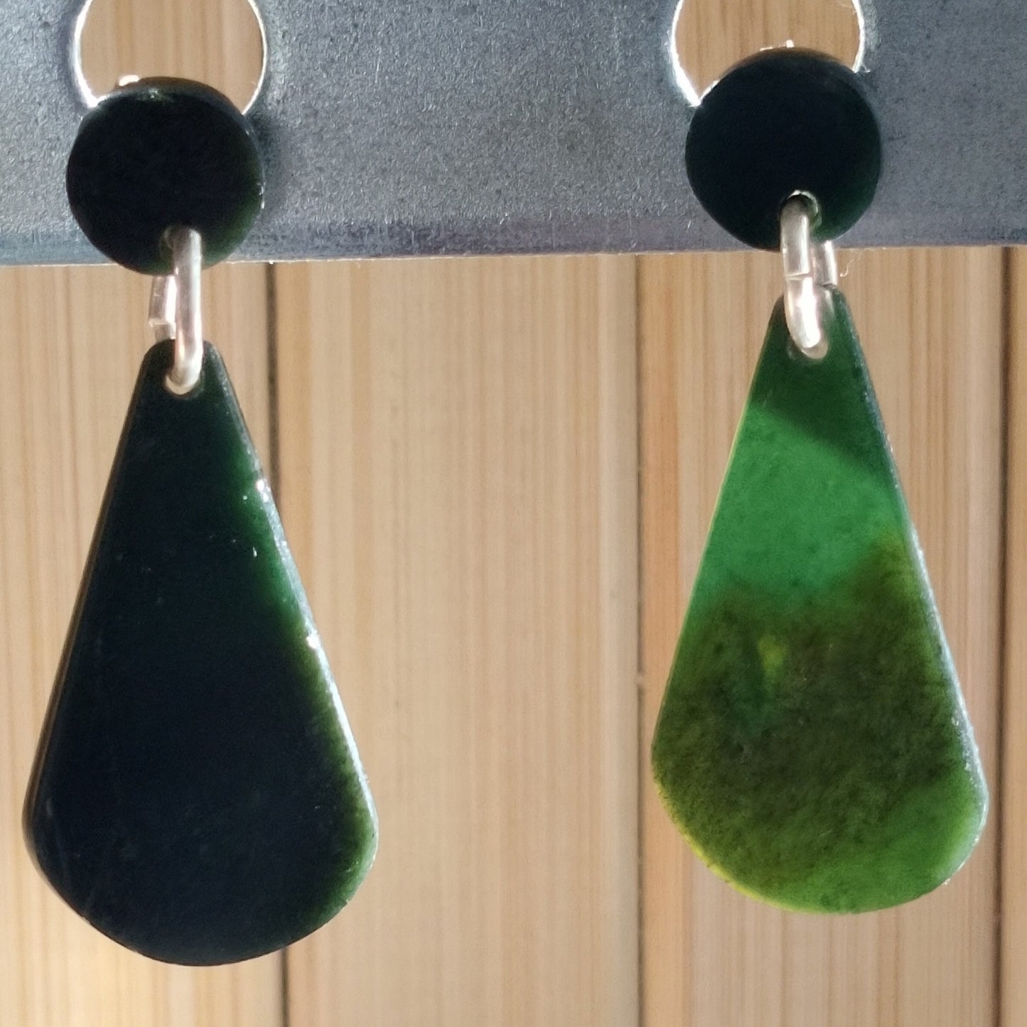 Modern drop style earrings featuring black and green jade set in sterling silver.
