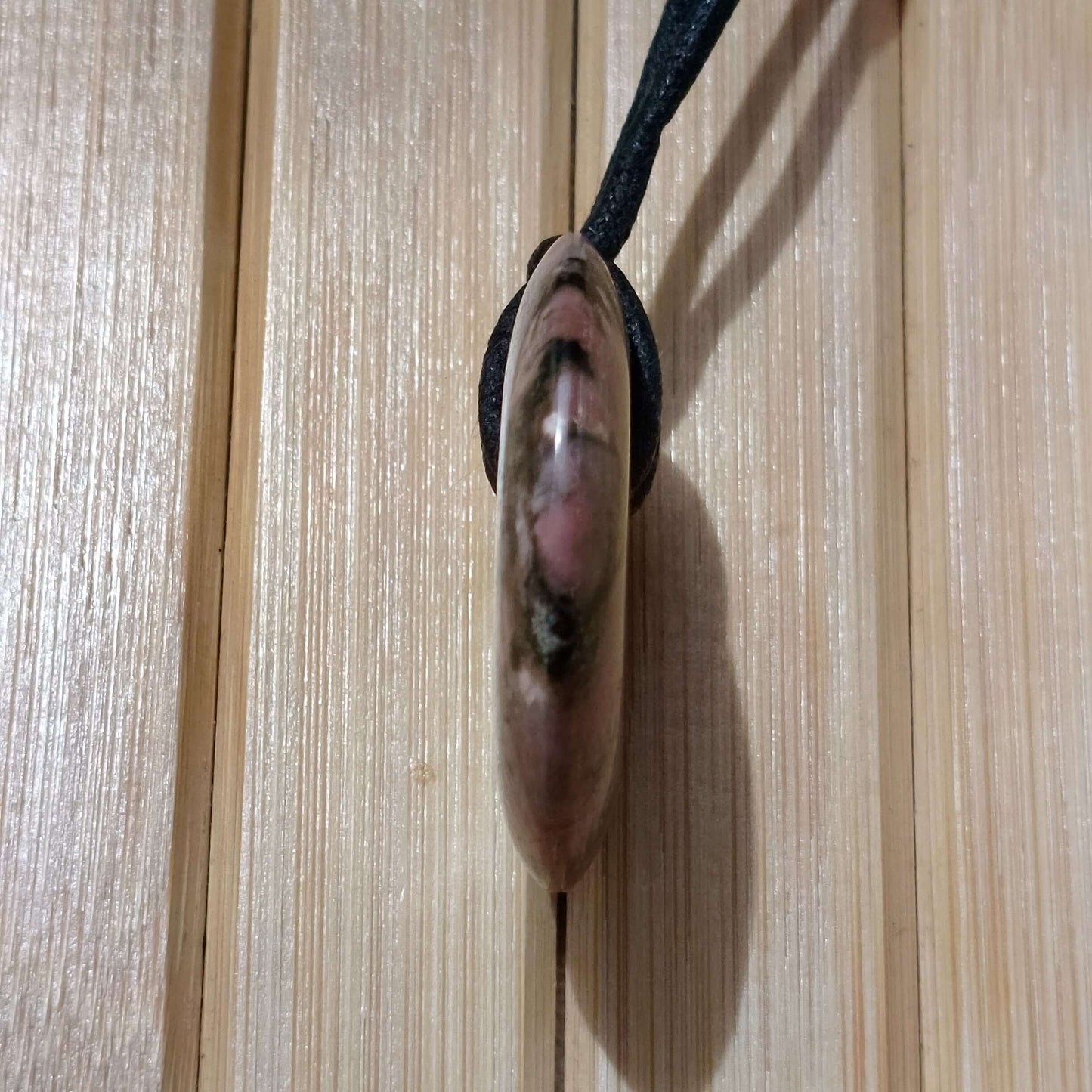 Rhodochrosite Pi Disc Pendant