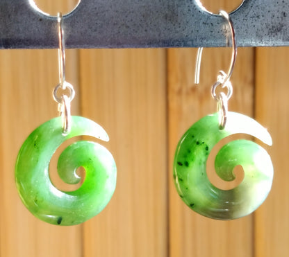 Jade Green Spiral Earrings showcasing a smooth jade stone in a stylish spiral design with silver hooks.